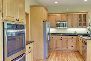 Stainless steel appliances and granite counter tops showcase this kitchen