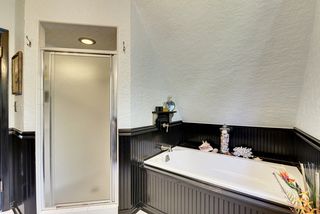 The luxurious 2nd Floor Bathroom features a Walk-In Shower with Subway Tile & Bathtub!