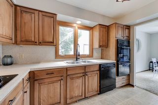Standing in kitchen, formal dining room towards the right