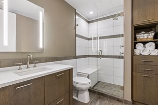Three-quarter guest bath with walk-in shower and bench. Custom built-in storage.