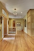 Front entry with freshly refinished hickory hardwood flooring