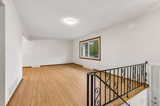 Spacious living room with beautifully refinished hardwood floors