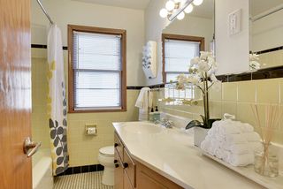 The Main Floor Full Bathroom features the Original Basket Weave Tile! 