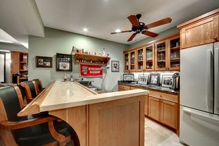 Custom built bar with lacquered maple top and custom cherry rail.