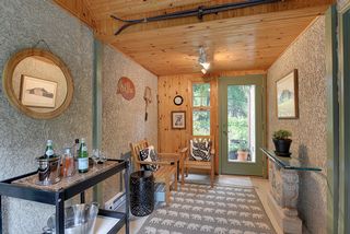 The "Breezeway" between the Garage & House wins the CHARMING award! Ideal for Winter Boots & Jackets in the Winter, and cozy napping & wine in the Summer...