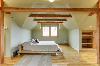 4349 Aldrich red birch platform bed was made for the space and will remain. Room is finished with red birch floors and fir beams.