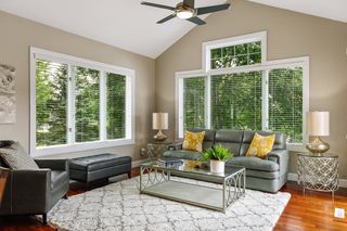Sunroom with vaulted ceilings and sliding glass doors to your deck