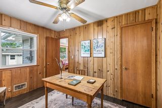 Adorable third bedroom is staged as an office