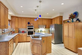 Enjoy preparing your favorite meals in this grand kitchen with lots of cabinets and counter space...