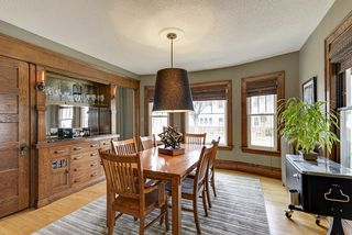 dining room with marble built-in bar and Edison Lamp sconces