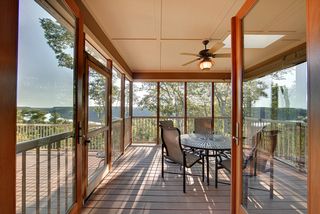 Glass, Marvin doors lead you from the Kitchen/Great Room to the Screen Porch.