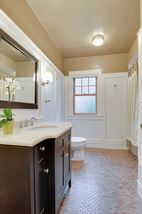 The New Custom Designed Bathroom could easily be in a Restoration Hardware Catalog! Custom Tile, Privacy Glass, High-End Vanity & gorgeous Floor Tile complete the project!  