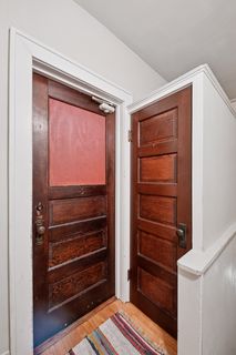 Upper-level front entry to Apt 3.
Features Hardwood flooring and additional storage closet.