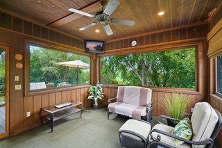 Three-season porch off the deck - you feel like you're in a treehouse! 