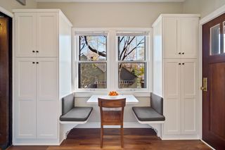 and bench seating bookended with more storage and door to back and side yard decking