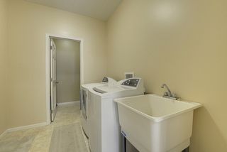 Main floor laundry with walk-in closet