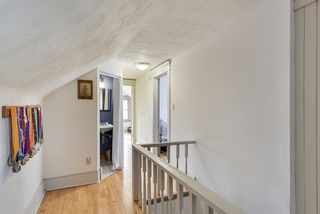 Upper hallway leading to 2 bedrooms and a half bath