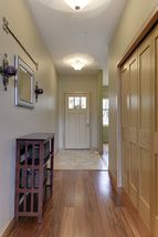 Tiled entry - hard wood paneled doors.