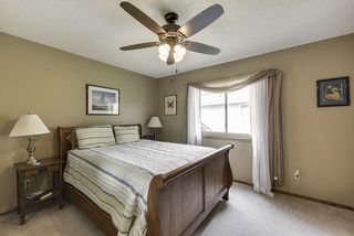 Master bedroom on the upper level with updated light fixture