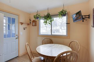 Enjoy informal dining overlooking spacious backyard...
