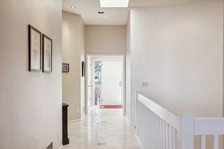 Looking from living area to light filled foyer.