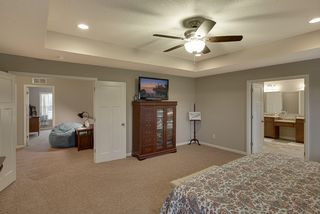 Large Master bedroom suite welcomes you in with double doors both to the bedroom and bathroom