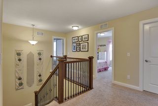 Upper Level landing hall. Door on right opens to huge walk-in storage closet.