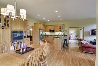 The gourmet kitchen, informal dining area and family room offers plenty of space for everyone
