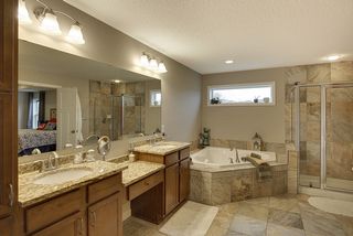 Custom tile, double vanity, large soaker tub, with separate water closet