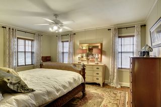 The Master Bedroom features gleaming Hardwood Floors & Original Picture Rails...
