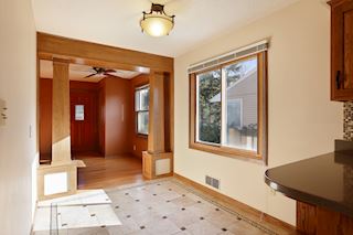 Kitchen opens to bright dining area