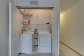 Main level laundry with shelving / storage