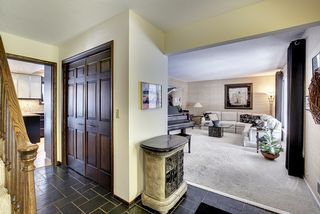 Front entry view of kitchen and formal living room
