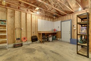 Generous single 1.5 stall garage with attached work shop. 