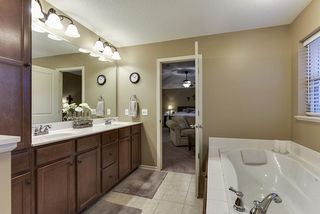 Tile floors and taller cabinetry with plenty of storage.