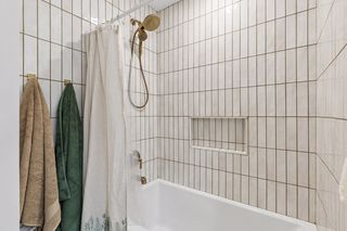 The main bath tile just keep going up to the higher-than-normal 8'3" ceiling throughout the main floor adding that little extra to the great spaces