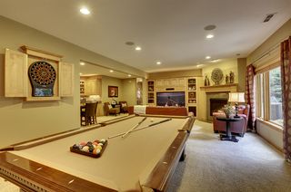 Billiard or game area with custom dart board built in