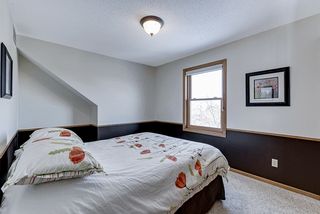 Bedroom 2 with wooded backyard views