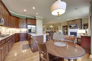 The kitchen features an abundance cherry cabinets and granite countertops.