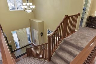 A view of the entry way from the upstairs hallway/landing.