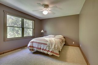 Additional bedroom on second floor - large, inviting windows create a sun-filled space.
