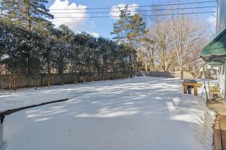 Open, flat back yard with fencing for privacy