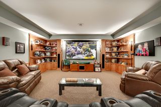 The cherry cabinetry houses the audio speakers and provides ample display space for those keepsakes.