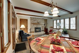 Spacious family room with beautiful hardwood floors and cozy fireplace