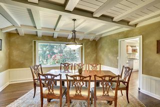 Formal dining room accented with gorgeous Black Walnut flooring.