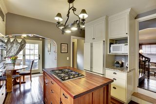 The Dual Staircase from the Kitchen leads to the Living Room and/or Upper Level...
