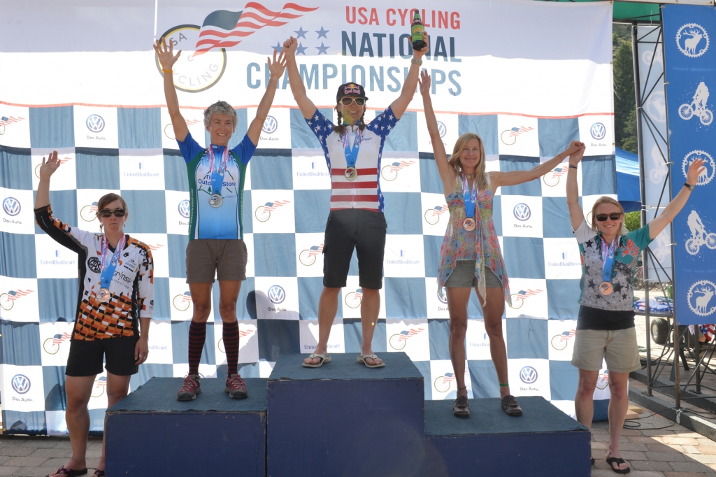 Rebecca Rusch stands atop the women's singlespeed podium