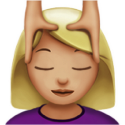 woman getting massage: medium-light skin tone emoji