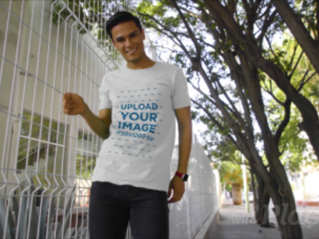 T-Shirt Video of a Young Man Posing by a Fence 3107v