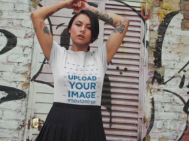 T-Shirt Video Featuring a Tattooed Woman Posing Against a Graffiti Wall 3117v
